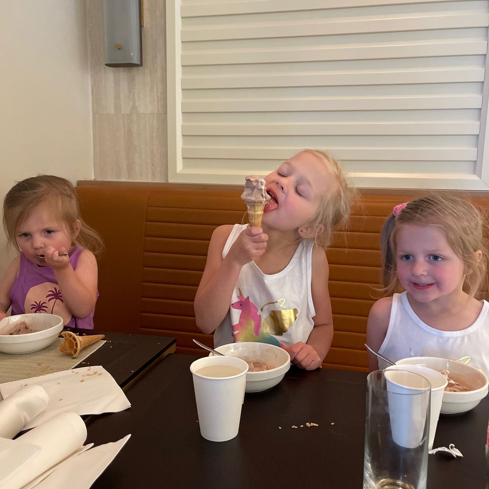 Lily, Cora, and Harper with ice cream cones after dinner at the Queen Mary 2 buffet
